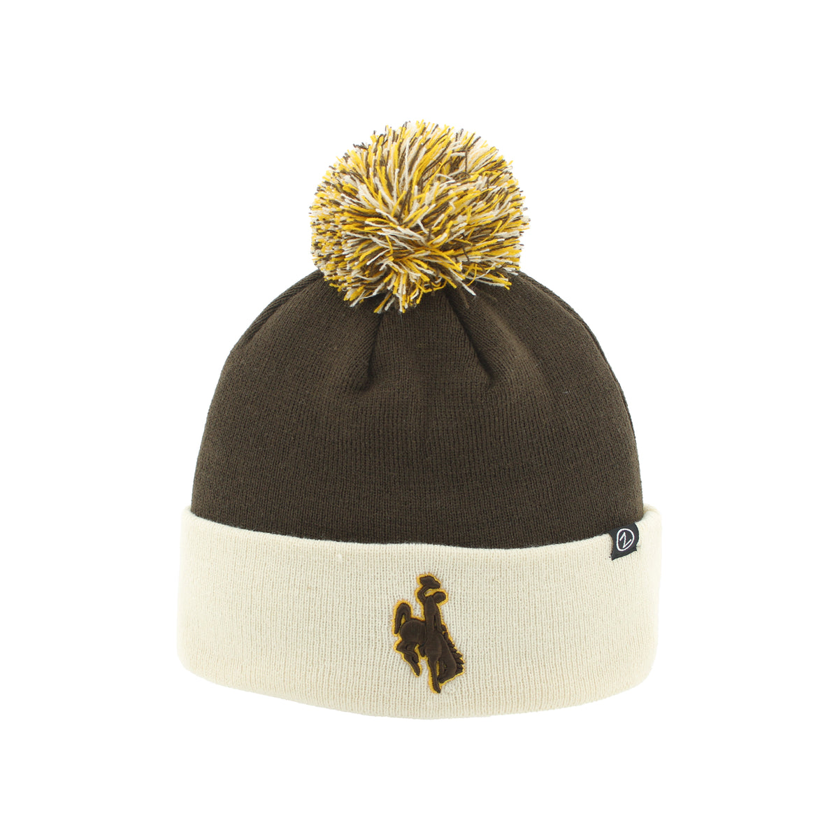 A knit pom-pom beanie hat in dark brown and cream, featuring a gold embroidered logo on the cuff and a gold and cream pom-pom on top, shown against a plain white background.