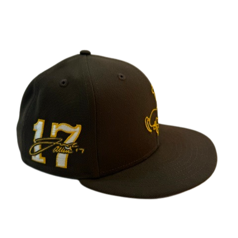 brown fitted hat with a josh allen drawn bucking horse outlined in gold on front panel. has 17 numbers with josh allen signature on right side of hat