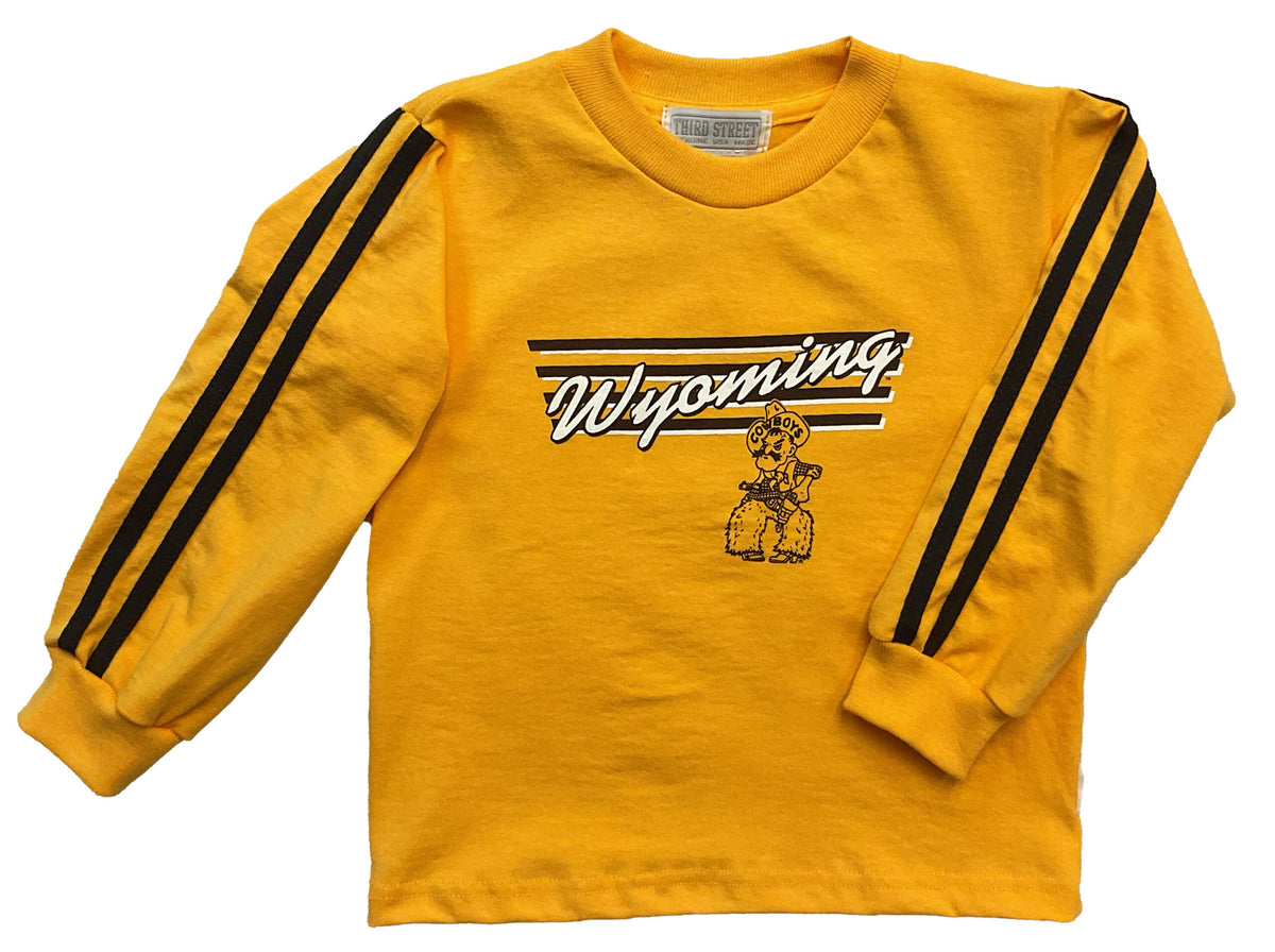 Gold toddler and infant long sleeve with two brown sleeve stripes. Brown/white slanted Wyoming script, Pistol Pete below, four brown stripes behind the text.
