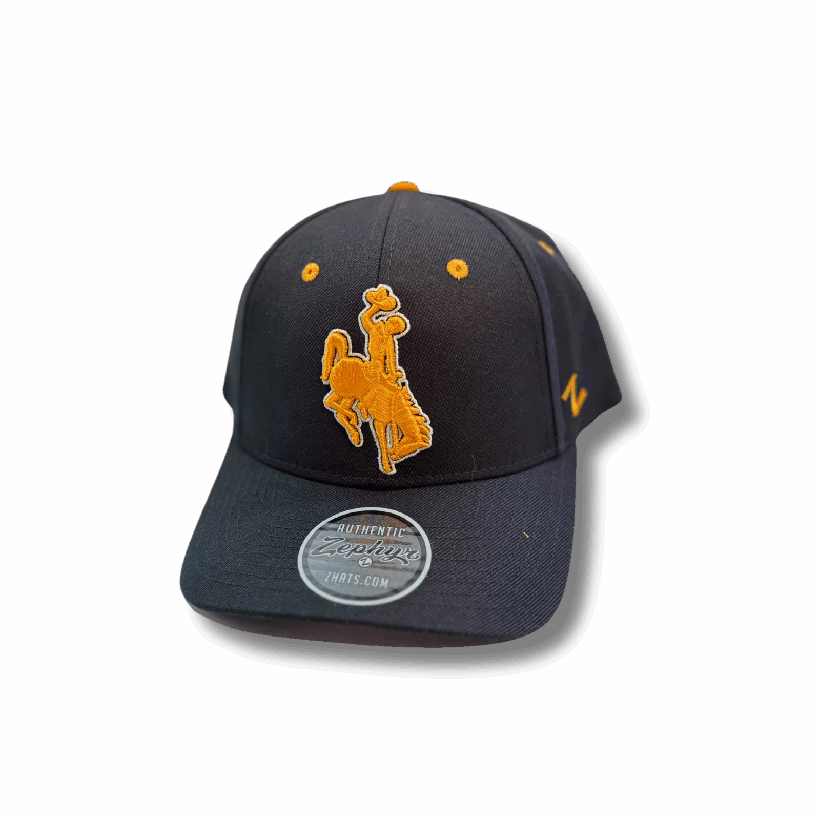 front of black adjustable hat with gold eyelets and gold embroidered bucking horse outlined in white in front center of hat