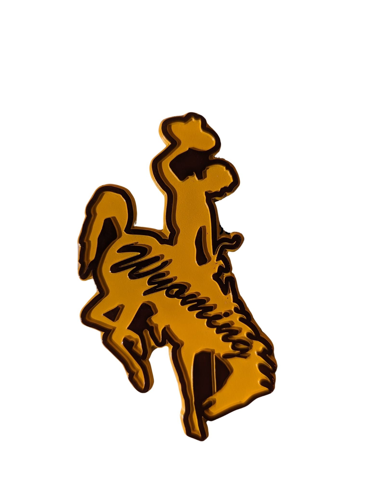 Bucking horse shaped magnet, design is gold matte coloring with script brown word Wyoming