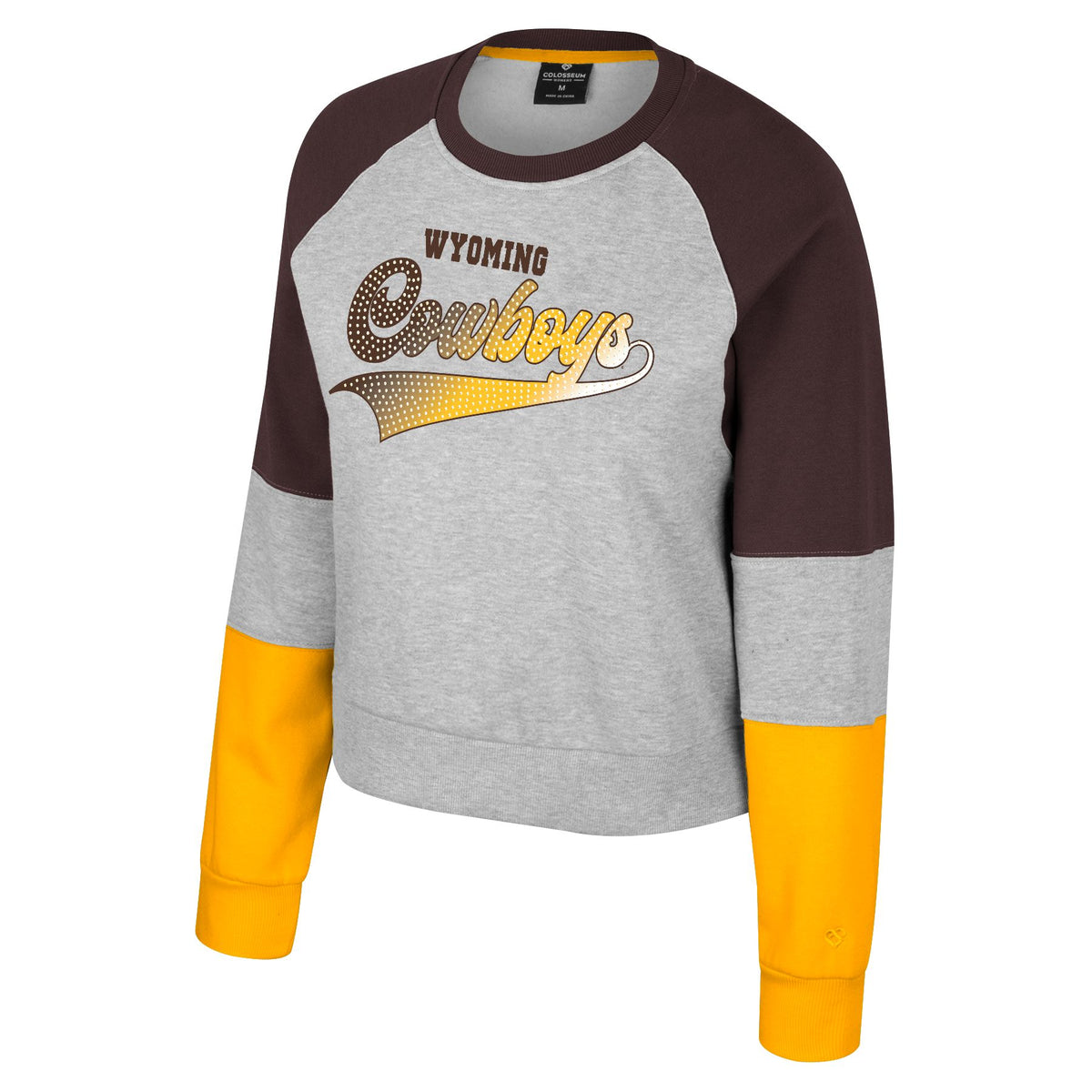 brown gold and grey crewneck. body is grey with design center chest. small wyoming in brown at top and large cowboys under in script with gradient brown to gold. Color blocked shoulders in brown and lower sleeve in gold