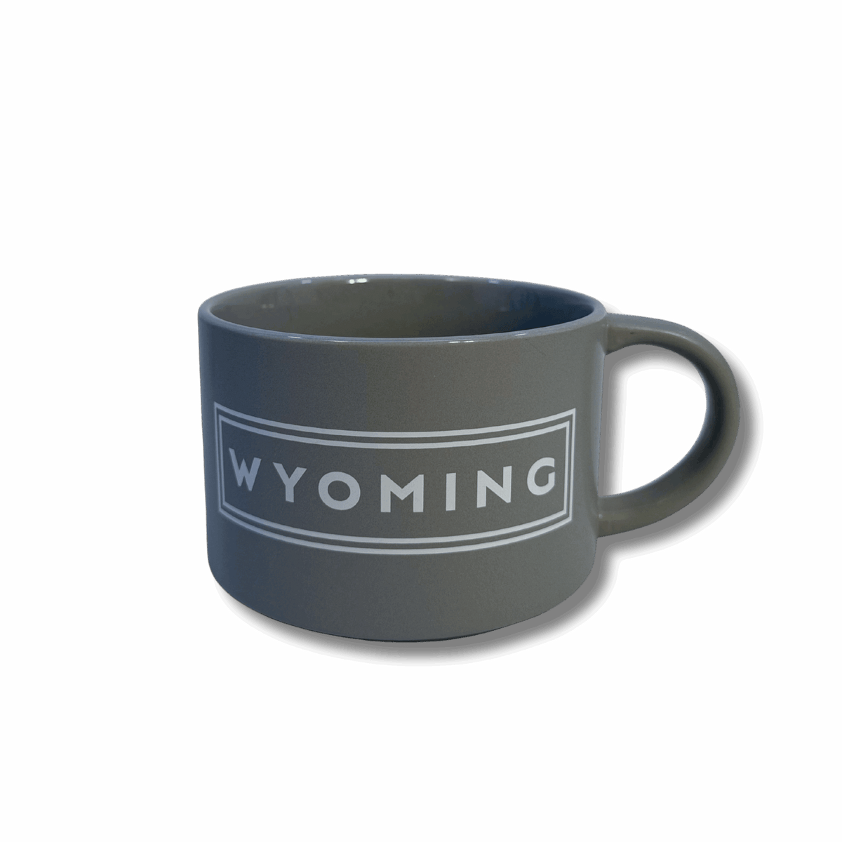 grey soup mug with handle. has white lettering that says wyoming with two white lines outlining the lettering in a rectangle shape