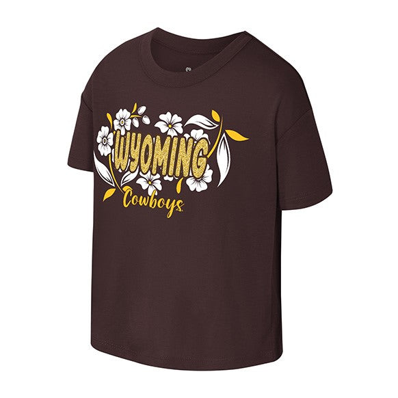 brown youth short sleeve tee with design center chest. design is wyoming in gold sparkle lettering with white flowers all around. has gold cowboys script at bottom.