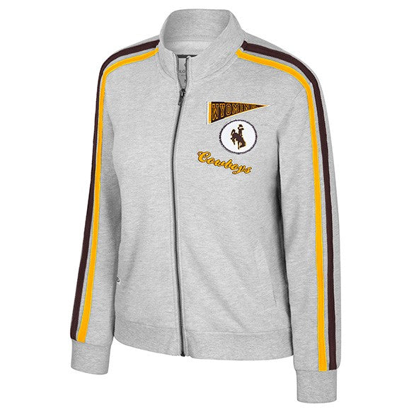 grey womens full zip jacket. has brown and gold stripes down each sleeve. has gold brown and white designs left chest. one pennant, one circle, and script cowboys.