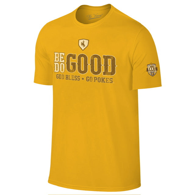 gold tee shirt with design center chest. design is be good do good god bless go pokes saying by josh allen. all in white and brown. has allen patch on left sleeve.