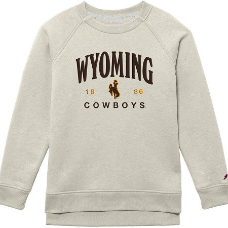 A cream-colored crewneck sweatshirt featuring a 'Wyoming Cowboys' graphic on the chest with a cowboy silhouette and the years '1886'.