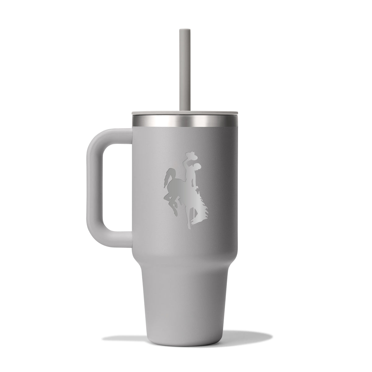 Gray hydro flask tumbler with handle and straw and an etched bucking horse logo on the side pictured on a white background