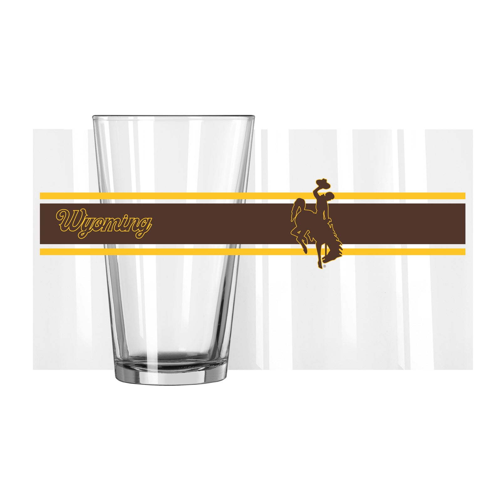 Clear 16 ounce pint glass with brown and gold wrap that has 'wyoming' script and bucking horse on side. All pictured on a white background.