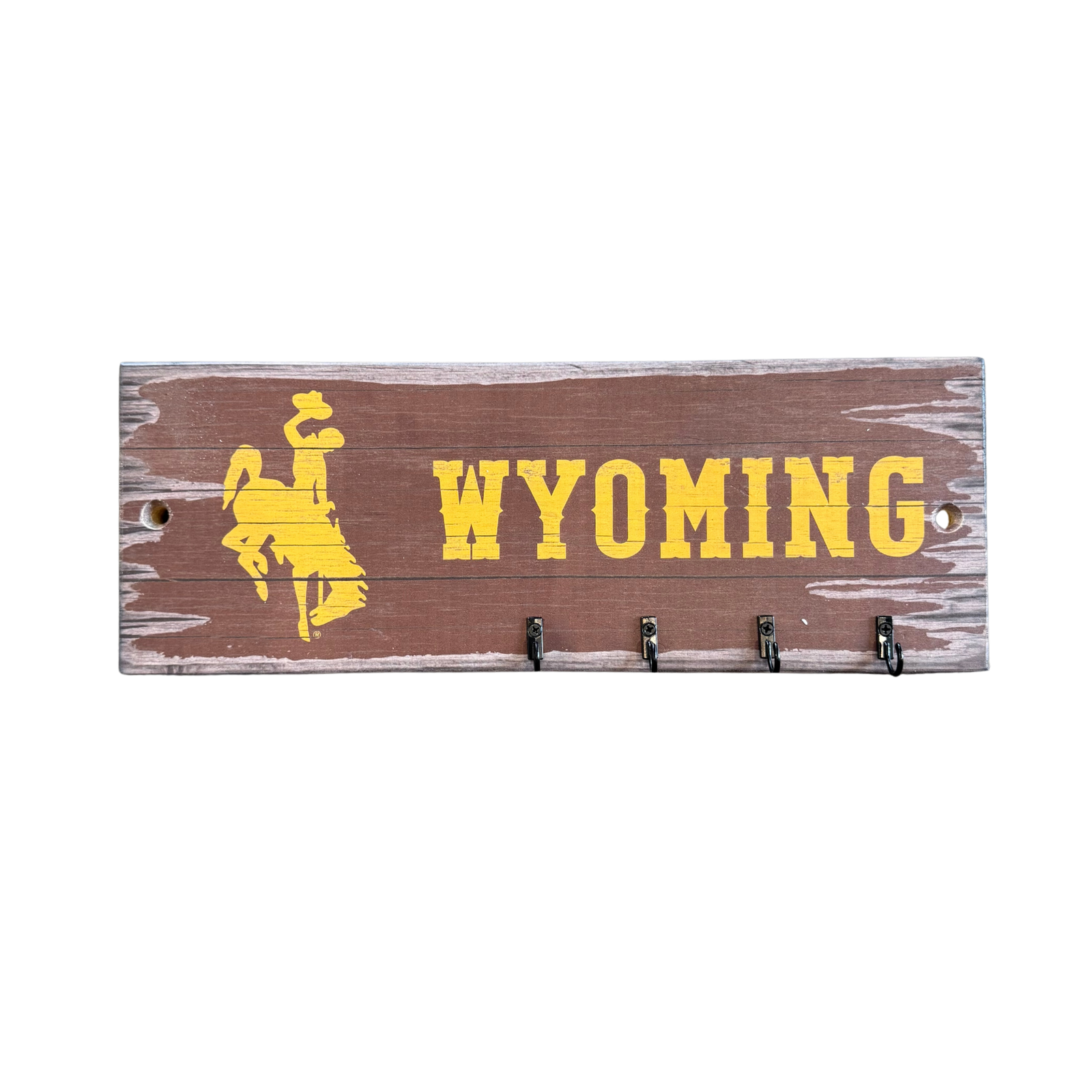 wooden keyrack with 4 hooks metal hooks to hang keys on. has gold bucking horse and wyoming design on for decoration