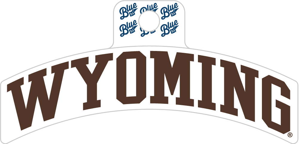 A white arched banner-style sign with the word WYOMING in large brown block letters. Above the letters is a white hanging tab with four blue script logos reading Blue.