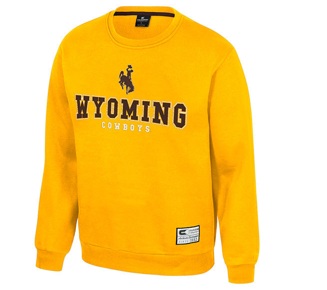 A bright yellow crewneck sweatshirt featuring the text 'WYOMING COWBOYS' and a bucking horse graphic in brown on the chest, displayed on a plain white background.