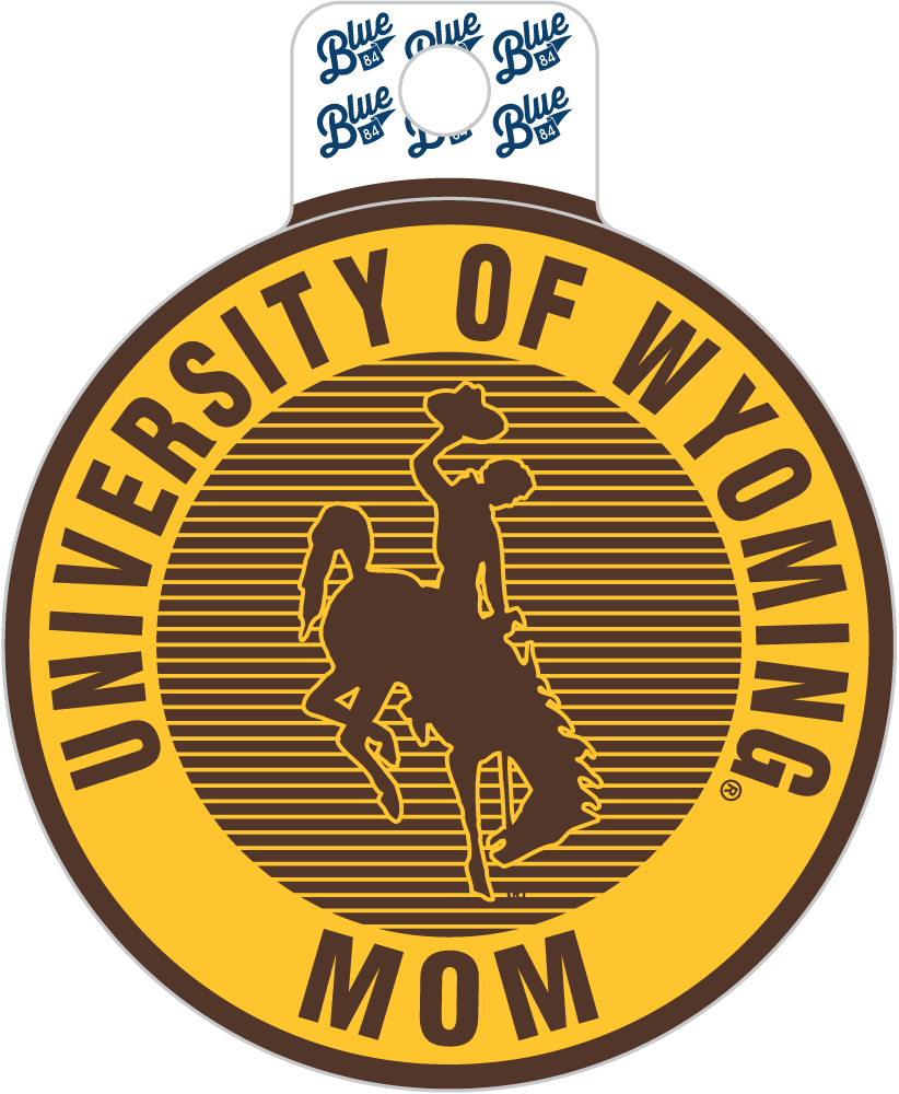 A die-cut sticker or decal featuring the University of Wyoming logo with a cowboy on a bucking horse. The design has a yellow outer ring with dark brown text reading 'UNIVERSITY OF WYOMING MOM' and a dark brown striped center with the cowboy silhouette.