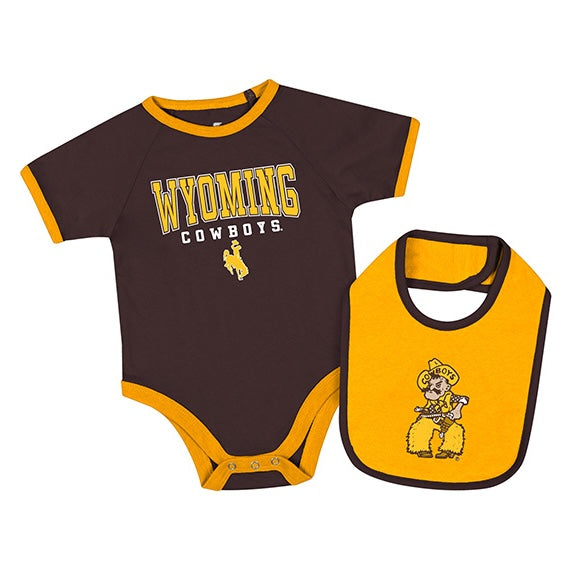 Brown infant onesie with a gold bib. Onesie says 'wyoming cowboys' with a bucking horse logo on front chest. Bib has pistol pete logo on front. All is pictured on a white background.