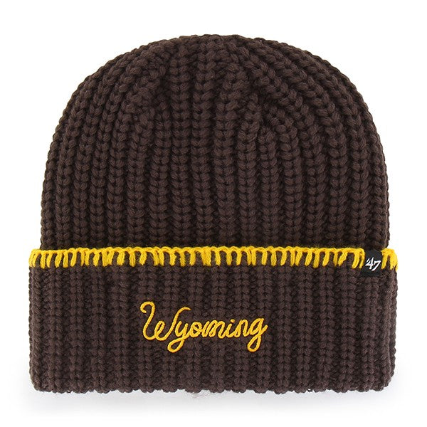 A dark brown ribbed knit beanie hat with a yellow embroidered 'Wyoming' script on the front cuff and a yellow stitched stripe around the fold, shown on a white background.