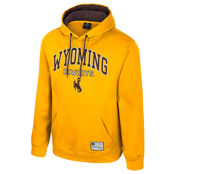 A gold pullover hoodie featuring 'WYOMING COWBOYS' printed in brown on the chest, with a cowboy graphic below. The hoodie has a dark brown interior lining and drawstrings.