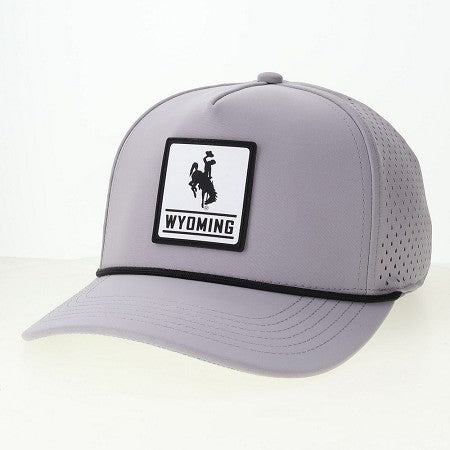 Grey adjustable trucker hat with black rope across bill. Has white silicone patch on front panel with black outline and black bucking horse and wyoming on the inside