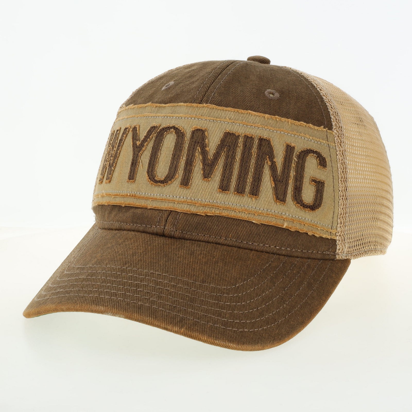 Brown and beige cap with 'WYOMING' patch on a white background