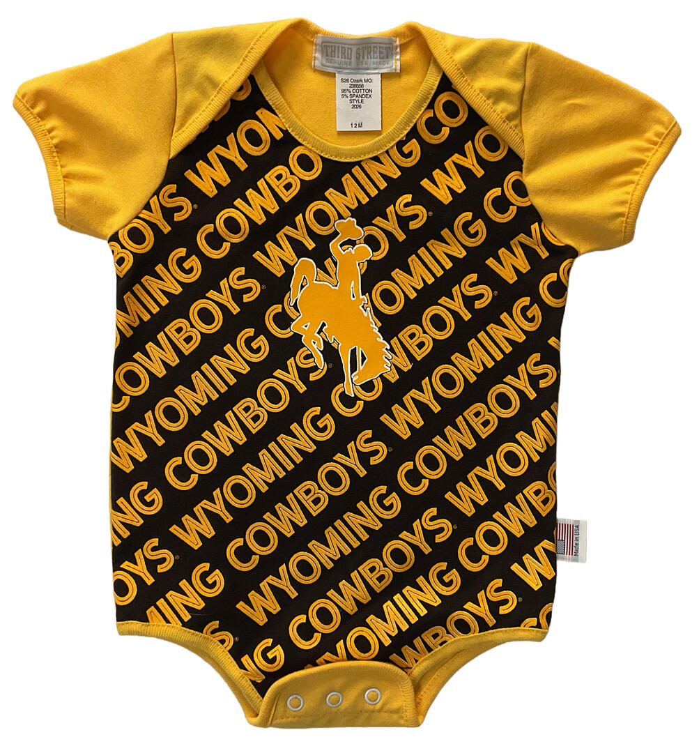 brown and gold baby onesie with Wyoming Cowboys text and bucking horse logo repeating all over in gold and white.
