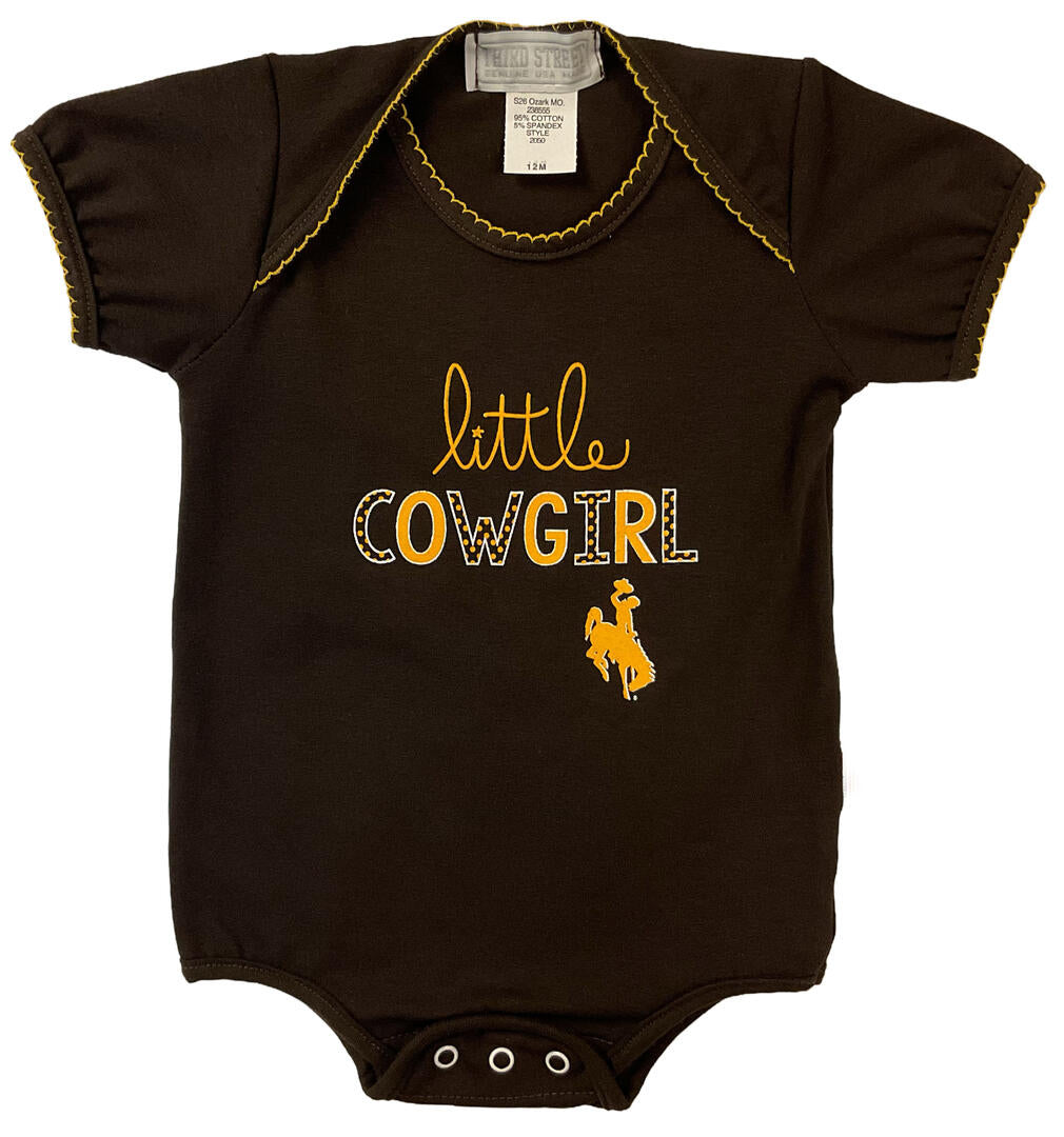 brown onesie with 'little cowgirl' lettering on gold and white on the front with bucking horse logo below.