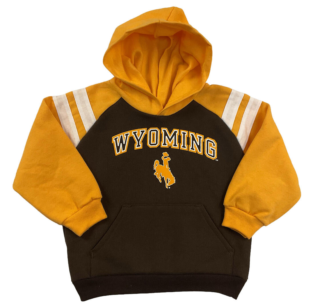 A infant pullover hoodie in dark brown and gold, featuring 'WYOMING' and the Wyoming Cowboys logo on the chest, with white and gold stripes on the sleeves.