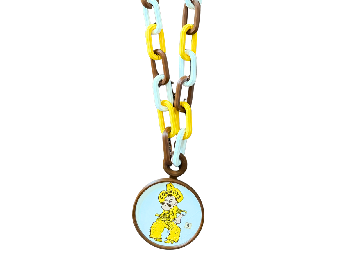 Brown, gold and white hype chain with circular ornament hanging. Has gold brown and white pistol pete logo. Hype chain is pictured on a white background.