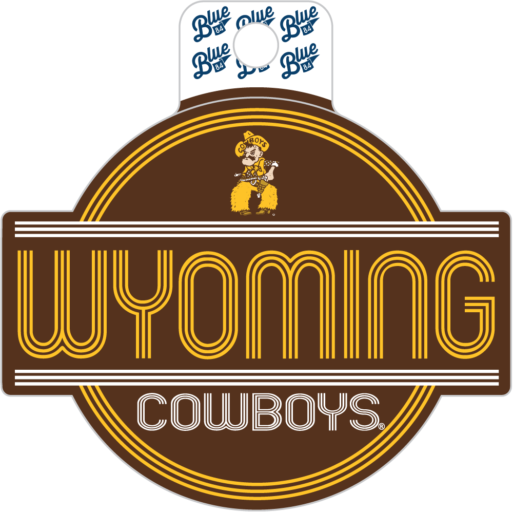 A Wyoming Cowboys logo decal or sticker on a plain white background. The design features a brown oval with yellow and white text reading 'WYOMING COWBOYS,' a small cowboy illustration above, and a white hanging tab at the top with repeated blue 'Blue' script.