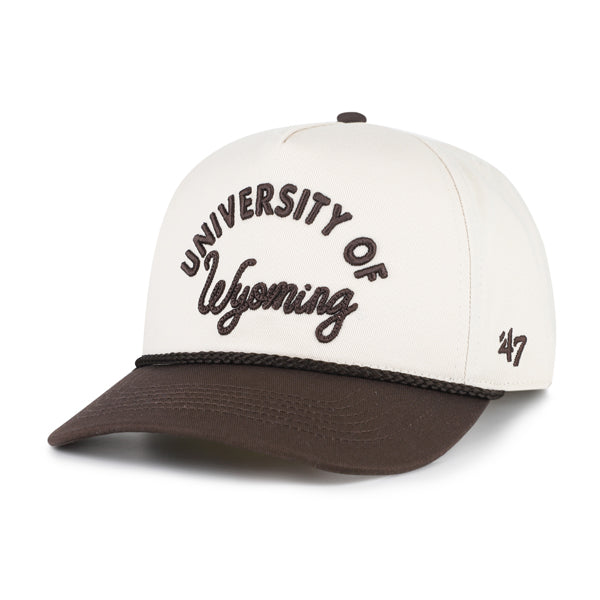 A structured baseball cap with an off-white crown and a dark brown visor, featuring 'UNIVERSITY OF Wyoming' embroidered on the front in brown, and a small '47' logo on the side.