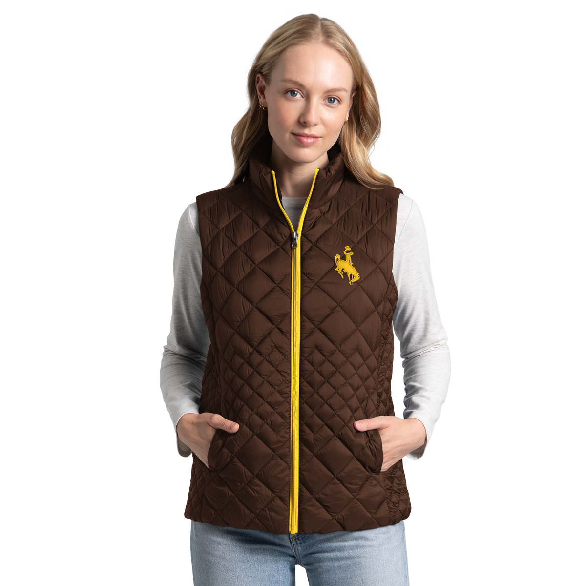Women modeling a brown vest that has a gold zipper. Has gold bucking horse logo on left chest