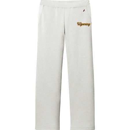 Oatmeal heather sweatpants with 'wyoming' script in brown on left leg by pocket. Pictured on a white background.