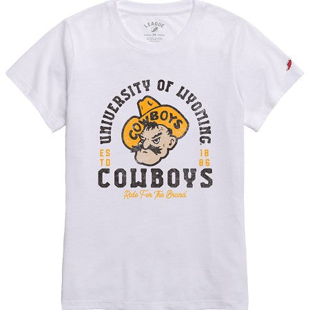 White women's tee shirt with black and gold design all over front. has university of wyoming arched with pistol pete under and cowboys at bottom with ride for the brand under