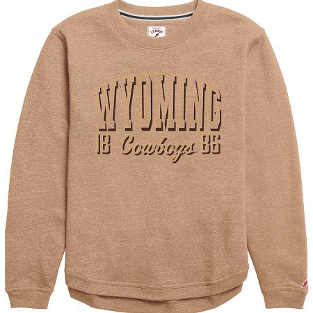 A tan heather crewneck sweatshirt featuring 'WYOMING 18 Cowboys 86' printed in dark brown across the chest, displayed on a clean white background.