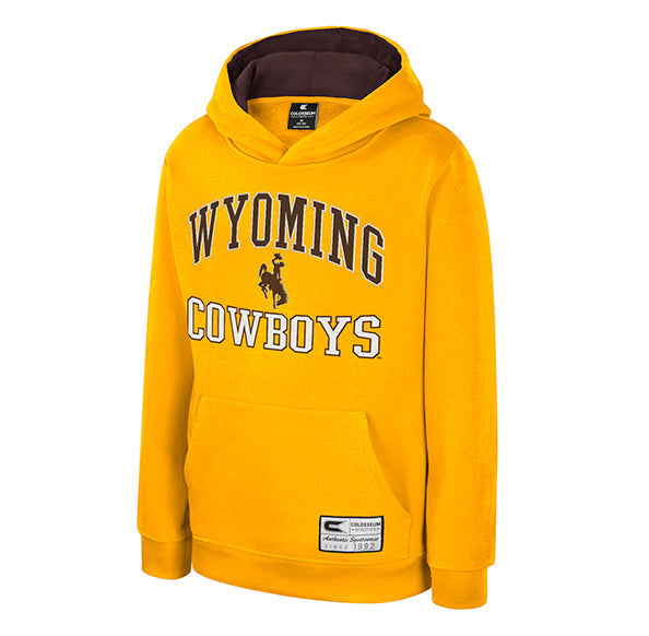 A gold pullover hoodie featuring 'WYOMING COWBOYS' printed on the front in brown and white, with a cowboy silhouette logo. The hoodie has a dark brown hood lining, shown against a plain white background.