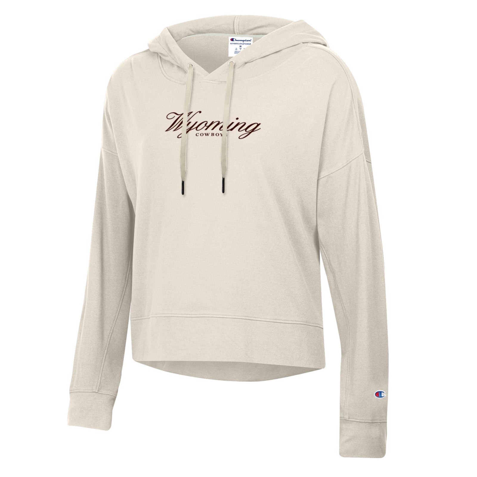 ivory women's champion sweatshirt with small brown design center chest. design is script wyoming with cowboys lettering below