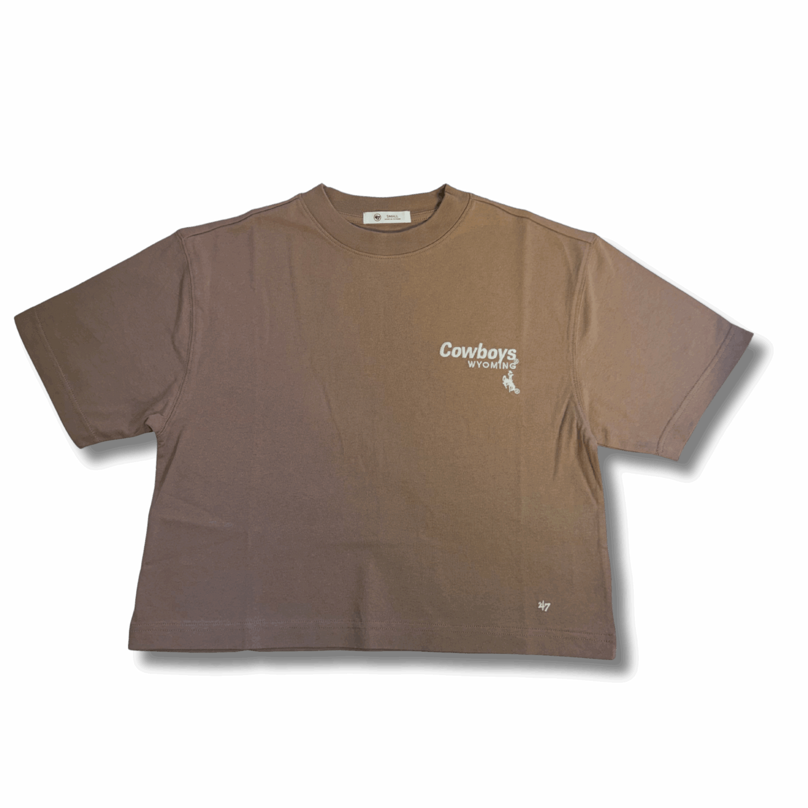 tan cropped tee with small white design on top left chest. design is cowboys lettering above wyoming. all above bucking horse
