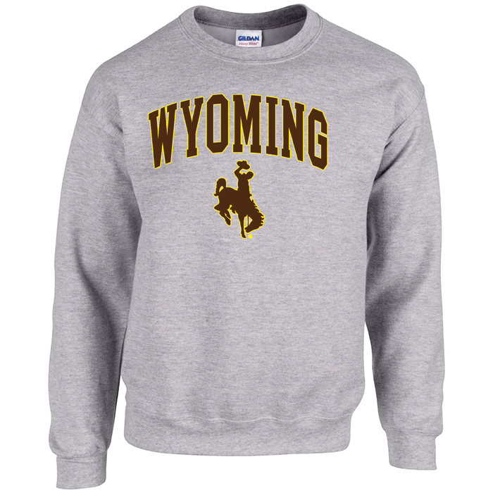 grey crewneck sweatshirt with design on front, design is word Wyoming arced, with bucking horse below, printed in brown with gold outline