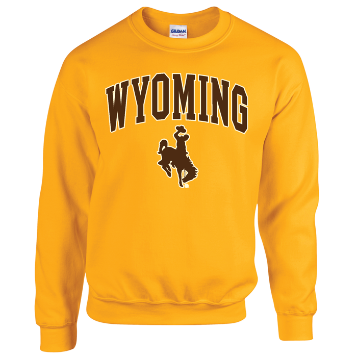 gold crewneck sweatshirt with design on front, design is the word Wyoming arced, with bucking horse below printed in brown with white outline