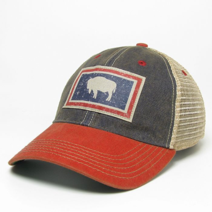 adjustable, unstructured hat with a red bill, navy front, and cream mesh back; Wyoming state flag distressed fabric patch on the front