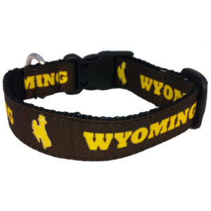 nylon brown dog collar with black stitching and hardware. Repeated Wyoming and bucking horse design printed in gold around the collar