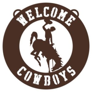 circular, brown metal wall sign. slogan Welcome Cowboys with bucking horse in the center. thin sheet metal material
