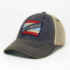 washed navy adjustable, unstructured hat with tan mesh back. Fabric striped patch in red and blue with word Wyoming on front