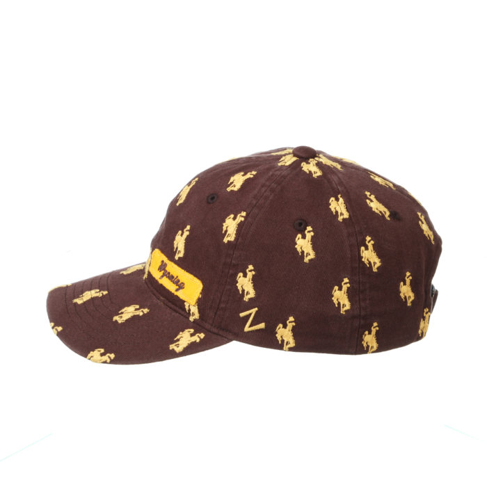 left view of brown adjustable, hat. gold bucking horses printed all over, Z logo embroidered in gold on left side