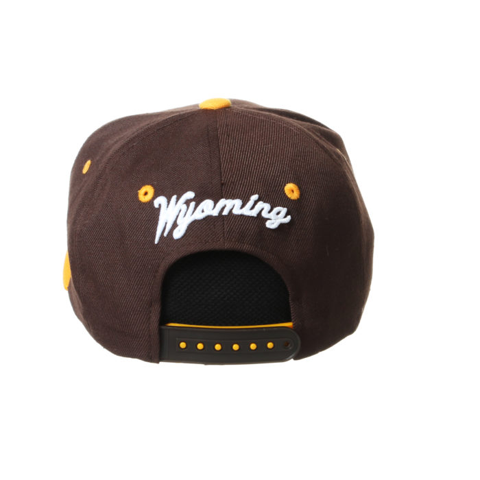 back view of youth sized, adjustable flat bill hat. brown body, gold bill. Word Wyoming embroidered above plastic closure in white script