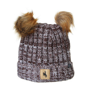 brown and white marled knit beanie. two faux brown fur pom poms on top of beanie. small patch with bucking horse sewn on the front cuff