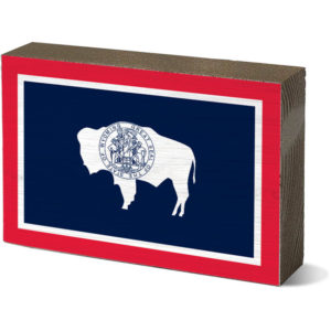 5 inch tall and 3.5 inch wide wooden block. Wyoming state flag printed on either side of wooden block