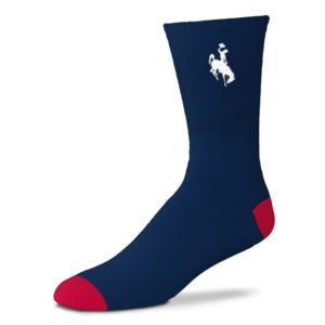 navy crew length sock. white bucking horse printed on top of sock. red colored heel and toe box of sock