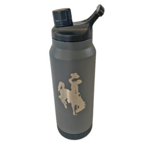 34 oz, stainless steel water bottle in grey. large bucking horse etched on front of bottle. magnetic twist top lid
