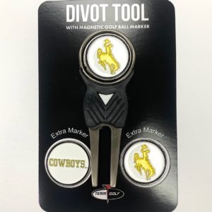 package with metal gold divot tool, and 2 ball markers. divot tool is black, with metal accents. bucking horse printed on top of divot tool.