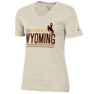 Women’s oatmeal short sleeved v-neck tee. Word Wyoming printed largely on front in brown. Word Cowboys printed in gold above