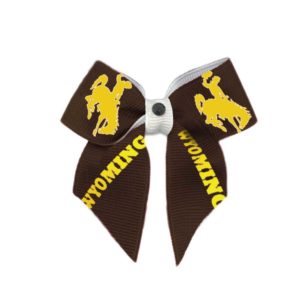 small fabric dog bow. Brown ribbon, with gold word Wyoming and bucking horse printed repeatedly on ribbon